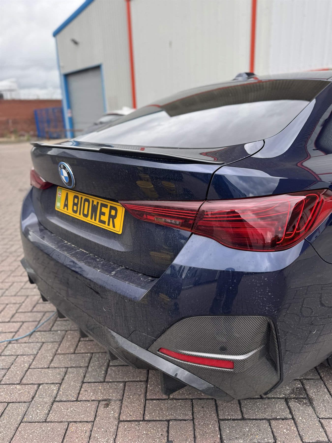 Blue BMW exterior before a maintenance clean